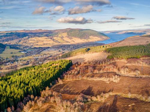 an aerial view of a valley with trees and water at Holiday Home Shepherds Hut by Interhome in Bearnock