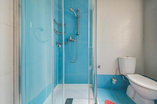 a bathroom with a shower and a toilet at Valletta 2 bedroom sleeps 6 apartment walking distance to centre and the sea in Valletta