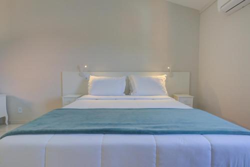 Postel nebo postele na pokoji v ubytování Filimahalo Hotel