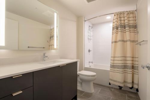 a bathroom with a sink and a toilet and a shower at South Lake Union 1br w wd roof nr Lake Union SEA-503 in Seattle