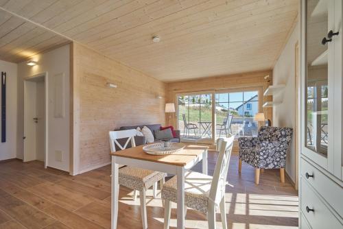 a kitchen and dining room with a table and chairs at Alb Appartements in Albstadt
