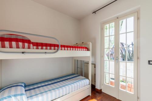 Dviaukštė lova arba lovos apgyvendinimo įstaigoje Casa Valdosti