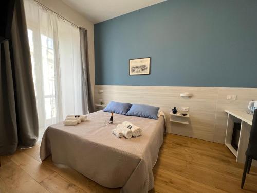 a bedroom with a bed with towels on it at B&B Costa degli Dei in Tropea