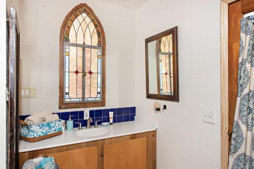 a bathroom with a sink and a mirror at Wanderer Studio, AN OFF GRID MOUNTAIN Guest Studio With Fantastic Views in Glenwood Springs