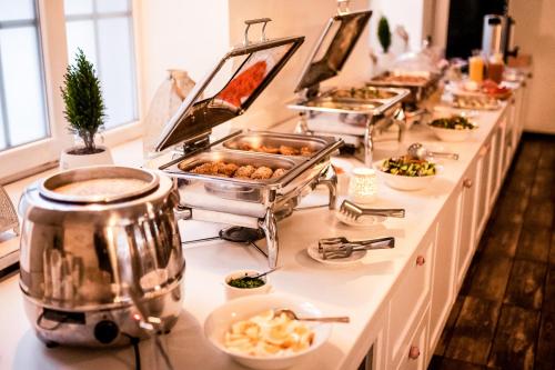 a buffet line with many different types of food at Maria Szczyrk in Szczyrk