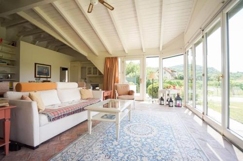 a living room with a couch and a table at Wonderful Villa among the Vineyards in Palt