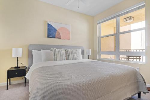 a white bedroom with a large bed and a window at San Bruno 1BR w Gym Pool Spa nr highways SFO-975 in San Bruno