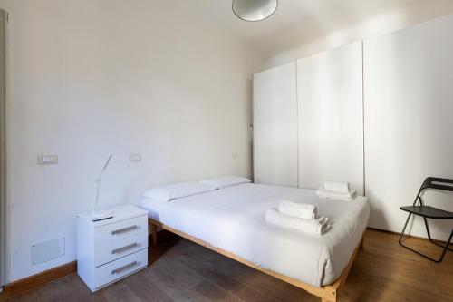 Ein Bett oder Betten in einem Zimmer der Unterkunft Milan Comfy APT - Calvairate District