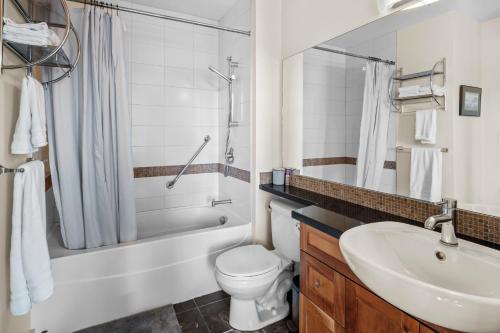 a bathroom with a sink and a toilet and a shower at Corazon Vista by Iris Properties! in Victoria