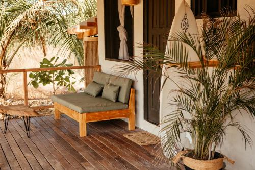 a chair sitting on the porch of a house at Casa Morrillo in Morrillo