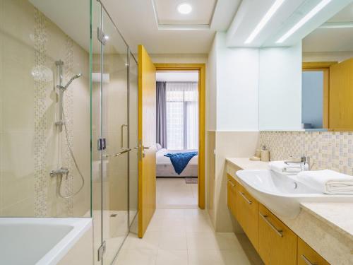 a bathroom with a sink and a shower at Downtown Charming Condo Close to Dubai Mall in Dubai
