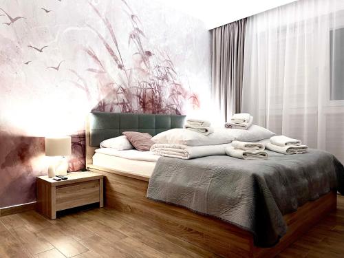Ένα ή περισσότερα κρεβάτια σε δωμάτιο στο Simba&Lea Apartament Ustronie Morskie