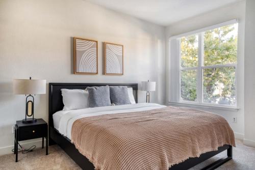 a white bedroom with a large bed and two windows at Sunnyvale 1BR w WD Pool Gym near Googleplex SFO-1112 in Sunnyvale