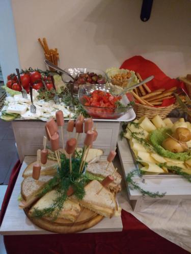 a table with a bunch of different types of food at Umberto House Catania in Catania
