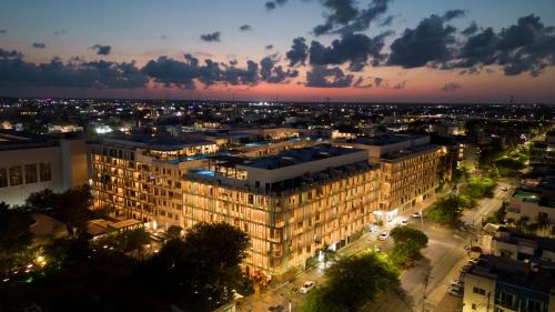 a view of a city at night with a building at New & Equipped Apartment Steps From The Beach With Pool Jacuzzi By Yeah in Playa del Carmen