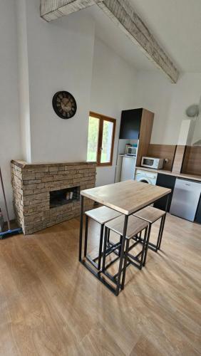 a kitchen with a table and chairs in a room at Campita in Omessa