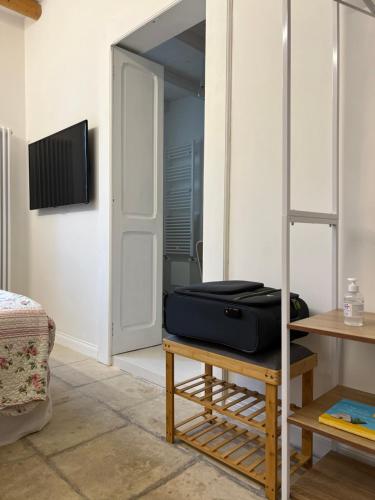 a suitcase sitting on a table in a room at Suite Battisti 7 in Lecce