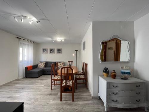 a living room with a table and a couch at Apartamento Sedassos Circo Romano in Tarragona