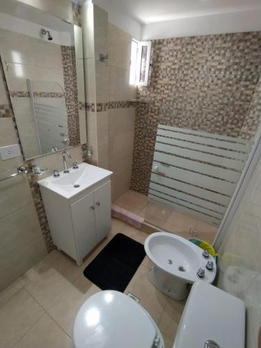 a bathroom with a sink and a toilet and a shower at sambernardo in San Bernardo
