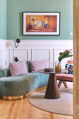 a living room with a couch and a table at Sublime Lisboa in Lisbon