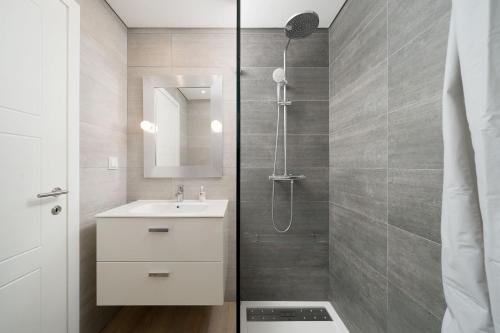 a bathroom with a sink and a shower at Casa Alessa - Vale de Lobo in Almancil