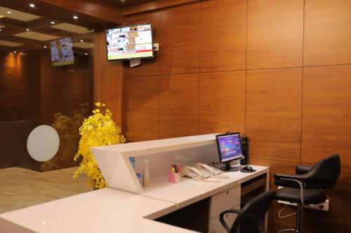 an office with a desk with a computer on it at HYDEPARK REGENCY in Palakkad