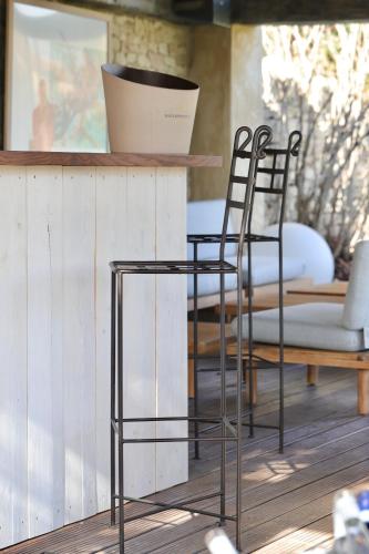 a pair of chairs sitting next to a table at LA FERME DE LA HUPPE in Gordes