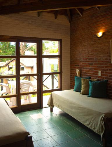 Cariló Paradise Apart Hotel & Spaにあるベッド