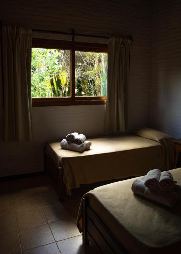 Cariló Paradise Apart Hotel & Spaにあるベッド
