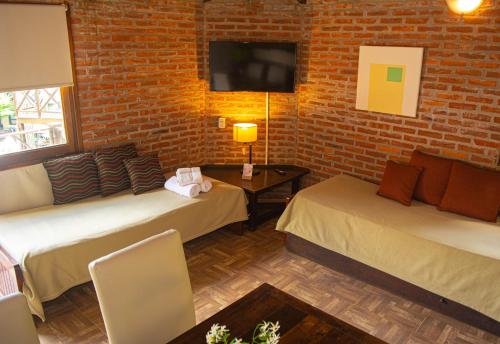 Cariló Paradise Apart Hotel & Spaにあるベッド