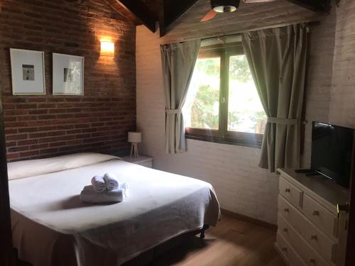 Cariló Paradise Apart Hotel & Spaにあるテレビまたはエンターテインメントセンター