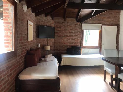 Cariló Paradise Apart Hotel & Spaにあるベッド