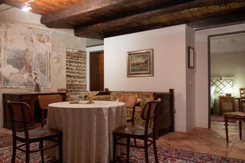 a dining room with a table and chairs in a room at Castello di Castellengo in Cossato