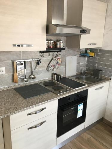 a kitchen with a stove and a sink at IN CENTRO A RAPALLO in Rapallo