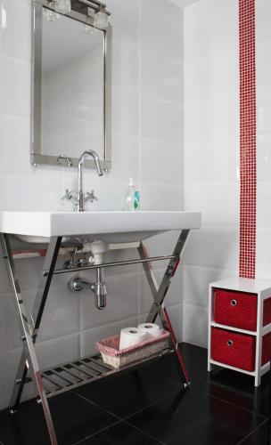 a bathroom with a sink and a shelf under it at Casa La Manzanera in Burgos