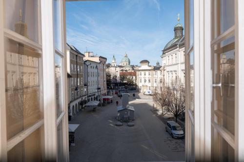 a view from a window of a street with buildings at Gasthaus Hinterbrühl in Salzburg