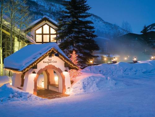 a gingerbread house in the snow at night at Vail Racquet Club Mountain Resort in Vail