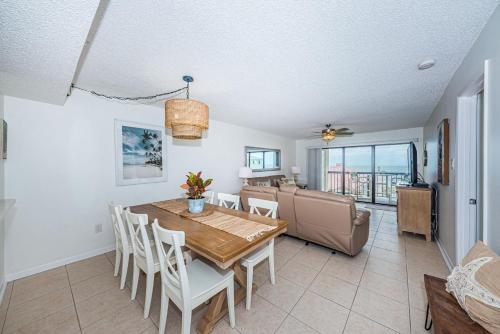 a dining room with a table and chairs at Sandcastle North Unit #403 in Clearwater Beach
