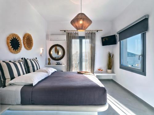 Ένα ή περισσότερα κρεβάτια σε δωμάτιο στο Ariti Seaside Residence