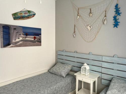 a room with a bed and a sink and a table at Torre de la horadada Alicante in Torre de la Horadada