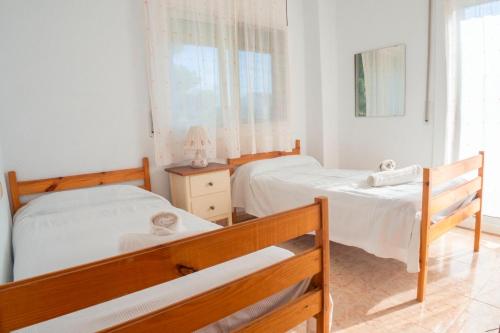 Ένα ή περισσότερα κρεβάτια σε δωμάτιο στο Club Villamar - Neron