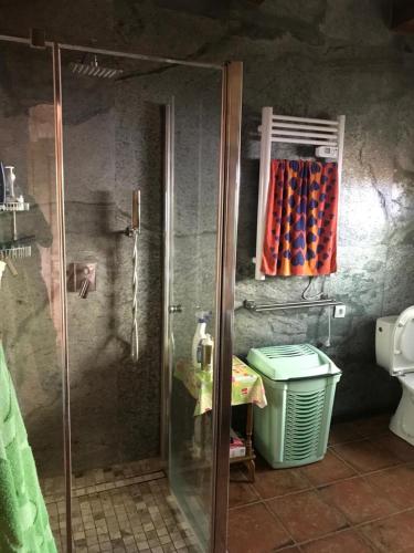 a shower with a glass door in a bathroom at Dom Nad Jeziorem Łąkorz in Łąkorz