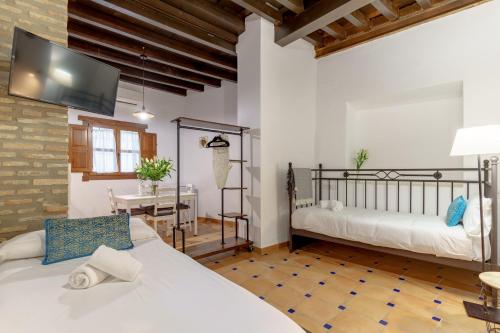Katil atau katil-katil dalam bilik di SUITES CASA DE LAS COLUMNAS