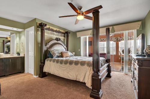 a bedroom with a bed and a ceiling fan at Family Friendly condo at Diamond Resorts! in Branson