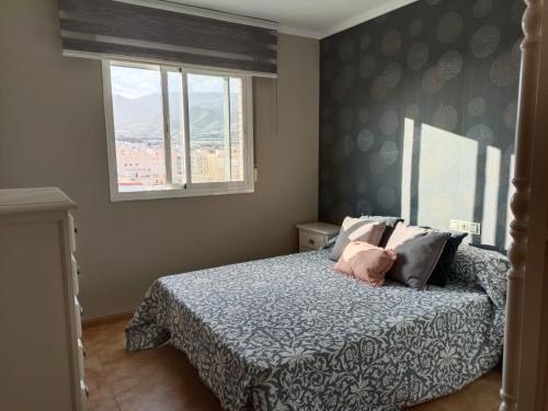 A bed or beds in a room at Apartamento entero Rosa Adra
