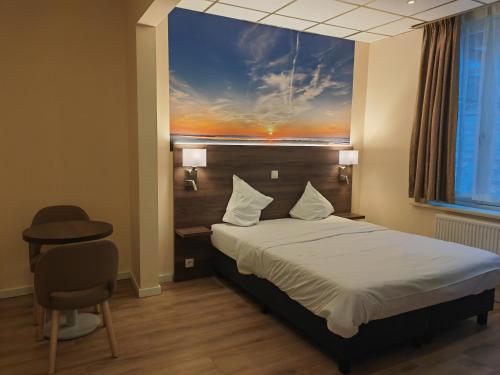 Ein Bett oder Betten in einem Zimmer der Unterkunft Hotel Albert II Oostende
