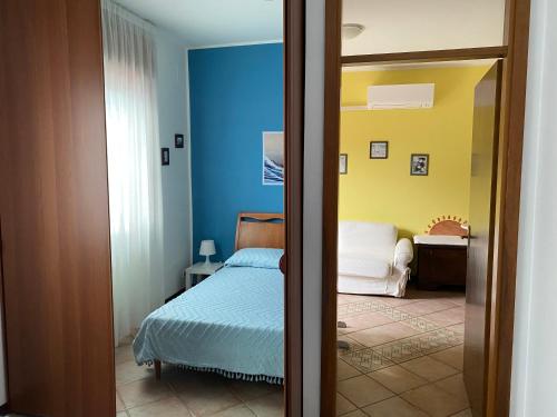a bedroom with a bed and a room with a bed at Apartment Fabiola in Sistiana