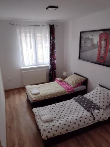 Postel nebo postele na pokoji v ubytování Apartament Jagielloński