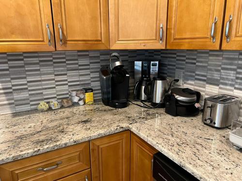 a kitchen counter with a coffee maker on it at Bright & Comfy 5 star Location Large Deck Oasis in Atlanta