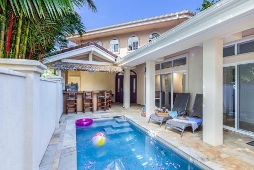 a swimming pool in the backyard of a house at Ohana Kamalani in Princeville